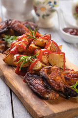 Roasted potato with chicken wings