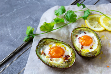 baked egg in avocado Boats. Copy space