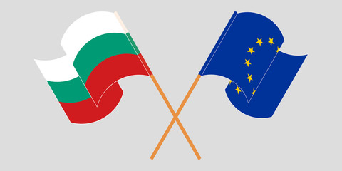 Crossed and waving flags of Bulgaria and the EU