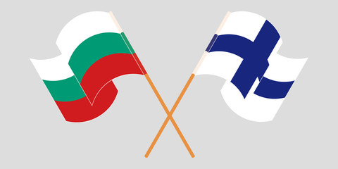 Crossed and waving flags of Bulgaria and Finland