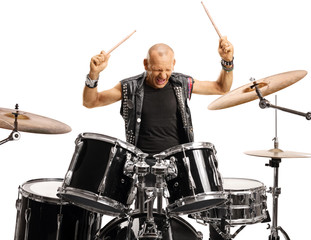 Bald man drummer starting to play drums