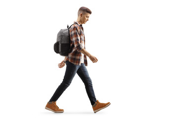 Sad male teenage student walking