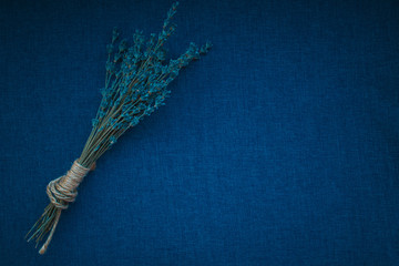 blue lavender bouquet on blue fabric background