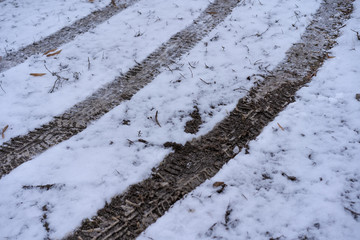 Car tire tracks in the snow