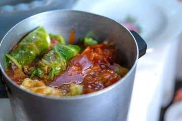 Cooking stuffed cabbage. Making minced meat in cabbage leaves.