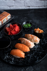 Close up of sashimi sushi set on black background