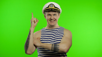 Young sailor man gets a great idea. Seaman guy in sailor's vest