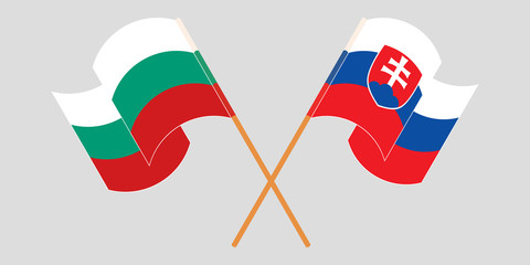 Crossed and waving flags of Bulgaria and Slovakia