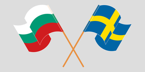 Crossed and waving flags of Bulgaria and Sweden