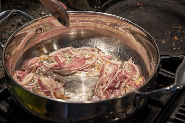 cooking onion in  frying pan