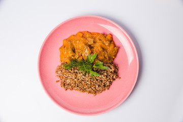 Meat goulash with buckwheat and mint leaves