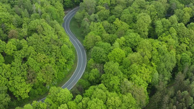 Aerial view of s-shaped rural road without traffic, Germany