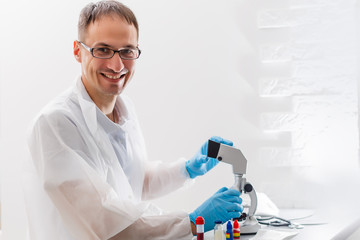 young male researcher carrying out scientific research in a lab