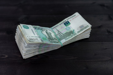 Bundle of money on wooden background