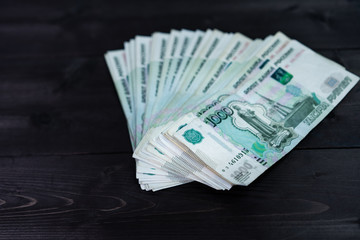 Bundle of money on wooden background