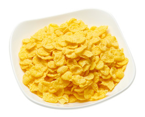 cereal flakes or corn flakes isolated on white background, macro photo