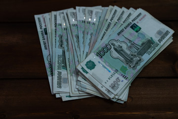 Bundle of money on wooden background
