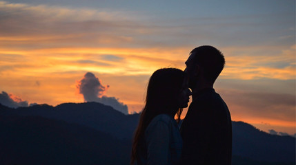 a lovely couple in the orange sunset