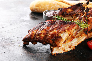 Grilled spare ribs for a tasty bbq meat with hot spicy barbecue sauce