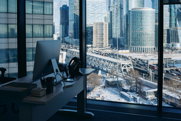 workplace in the office with a view of skyscrapers