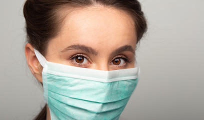 young woman with medical mask for corona