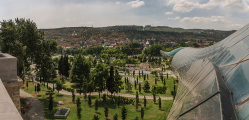 The view to Rhike Park in capital city of Georgia, Tbilisi. Contrast of the modern and ancient part of the city.