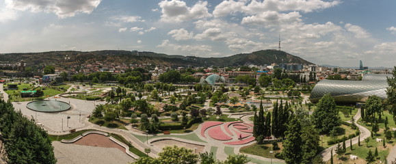 The view to Rhike Park in capital city of Georgia, Tbilisi. Contrast of the modern and ancient part of the city. - obrazy, fototapety, plakaty
