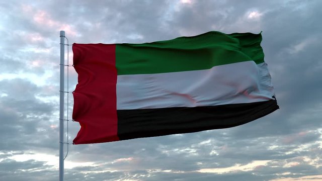 Realistic flag of United Arab Emirates waving in the wind against deep Dramatic Sky. 4K UHD 60 FPS Slow-Motion