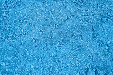 Fototapeta na wymiar background of loosened dried earth soil ground texture with nothing on it, ready for planting. toned classic blue color trend 2020 year
