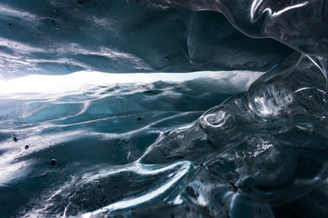 Close up in the inside of an ice cave in Matanuska Glacier, Alaska. Details of the surface of the...
