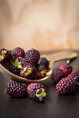 blackberry on a wood spoon