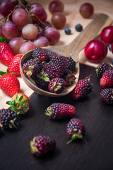 mixed berries in a wooden bowl