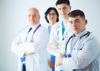 Successful medical team. Confident doctors team standing together and smiling