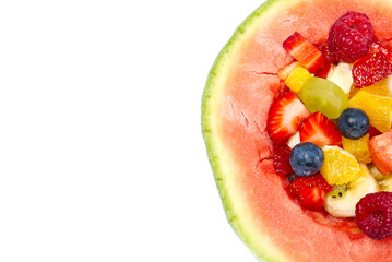 Watermelon filled with fresh fruit salad. isolated on white background