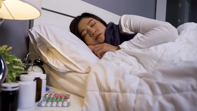 sick woman sleeping in a bed
