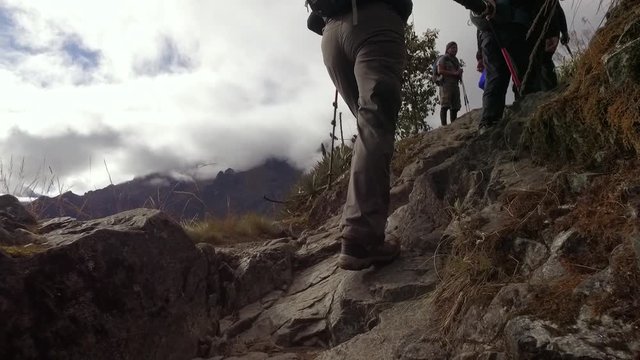 Slow motion, group of people hiking on Inca trail. Cusco, Peru