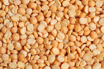 Dry chopped yellow peas. Food background. Macro.
