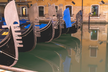 Fototapeta na wymiar gondolas docked on a tranquil canal in venice italy 