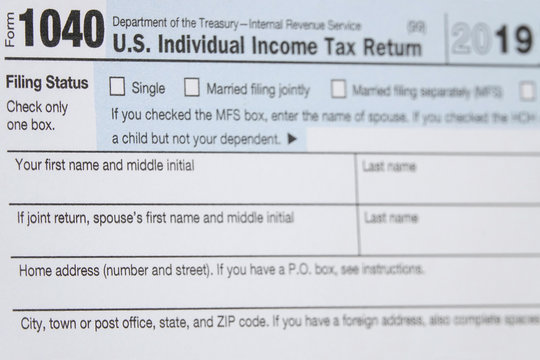 A printed IRS 1040 tax year 2019 form is shown in 2020 in a closeup view. The Internal Revenue Service tax filing deadline has been extended from April 15 to July 15 this year.