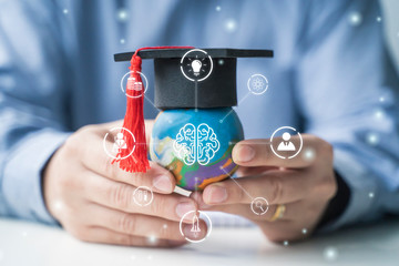 Learning and education teacher holding playdough world, graduation hat creative thinking improving...
