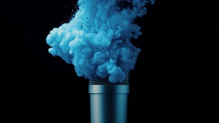 Blue paint spilling onto a microphone in water