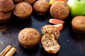 Apple Cinnamon Muffins with apples and cinnamon sticks
