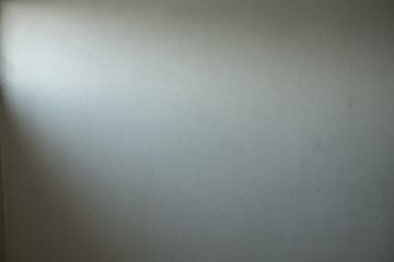 Fototapeta premium Old white concrete wall texture And the light that shines through the window