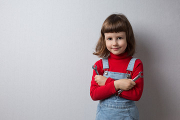 Girl playing auto mechanic, portrait