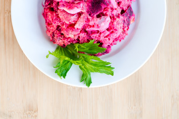 Fresh russian salad on a plate