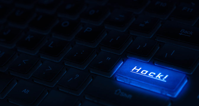 Hack computer concept. Hack word on blue keyboard button.