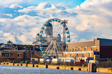 Helsinki. Finland. The Harbour Of Helsinki. Ferris wheel on the background of St. Nicholas...