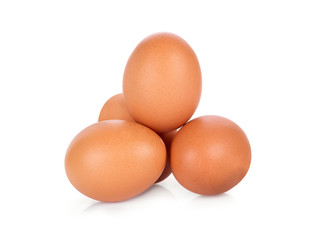 four chicken eggs isolated on white background