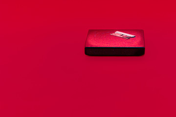 Rusty Razor Blade on a dirty Granite Coaster in a Moody Red Background Environment. Possible uses...