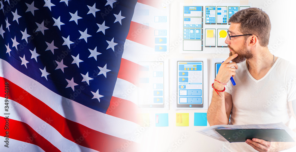 Poster a man is developing a mobile app. mobile app designer on the background of the american flag. a man 